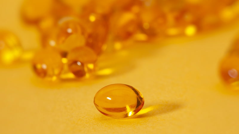 Close up image of multiple CBD capsules and pills