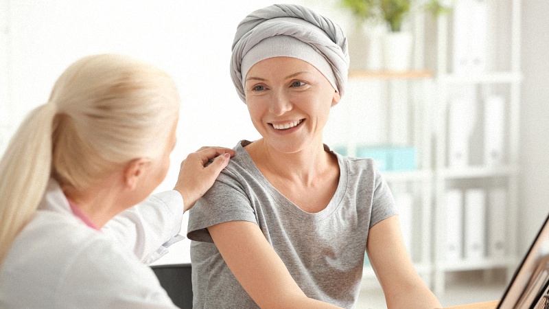 Cancer patient smiling while talking to another person