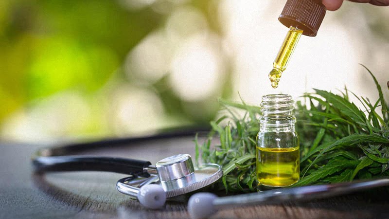 CBD Oil and Hemp Leaves with Stethoscope