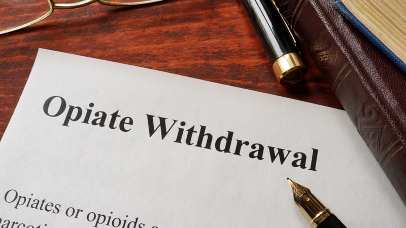 Opiate Withdrawal Written on a White Paper Beside Pen
